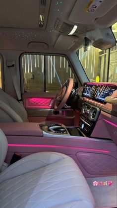 the interior of a vehicle with pink trim