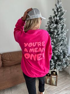 Experience ultimate comfort and style with our Pink You're a Mean One sweatshirt. Made with a 50/50 cotton-poly blend from renowned brands, Port & Co and Gildan. Unisex fit and puff vinyl detailing add a touch of uniqueness. Available in lime and heliconia. Get yours today! Puff Vinyl Shirt Ideas Christmas, Puff Vinyl Ideas, Puff Vinyl Shirt Ideas, Elf People, Vinyl Sweatshirt Ideas, Puff Sweatshirt, Merry Sweatshirt, Puff Vinyl, Sublimation Business