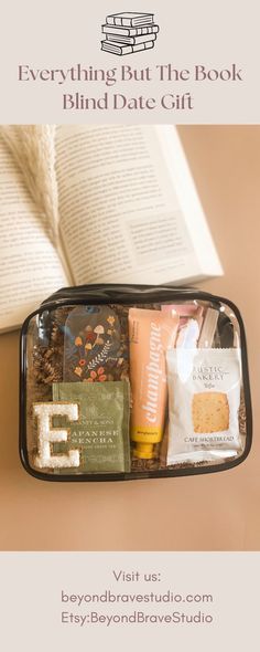 an open book sitting on top of a table next to a bag filled with books