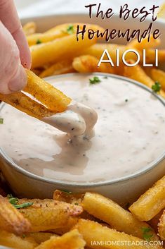 the best homemade aioli dip in a bowl with french fries and parsley sprinkled on top