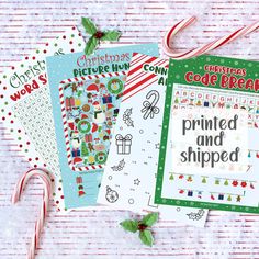 three christmas printables and candy canes on a table