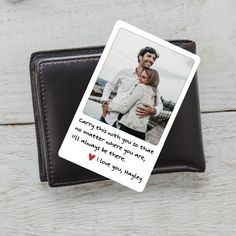 a personalized card with an image of a man and woman hugging in front of a wallet