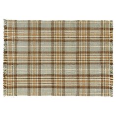 a brown and white plaid rug with fringes