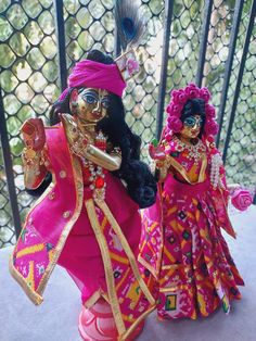 This is a set of radha krishna poshak. It includes 1 lehenga and 1 dupatta for radhaji and a dhoti with patka for krishnaji. Dabka Sets For Puja And Festivals, Festival Dabka Sets For Puja, Multicolor Dabka Traditional Wear For Puja, Multicolor Traditional Wear With Dabka For Puja, Traditional Multicolor Sharara With Tilla Detailing, Multicolor Semi-stitched Traditional Wear With Tilla, Festive Sets With Latkans For Puja, Multicolor Bollywood Choli With Dabka, Dabka Embroidered Sets For Puja And Navratri