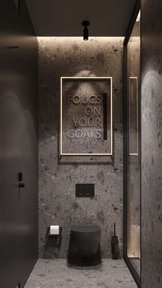 a bathroom with a sign that says focus on your goals