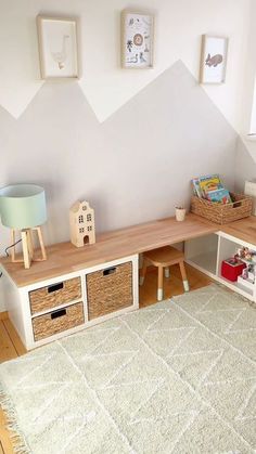 a child's playroom with toys and bookshelves on the floor,