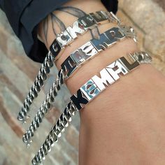 * All of the Product is Silver. * product weight is 33.30 grams in 5 letters, it may differ according to the number of letters in grams * chain width 8.50mm * letter width 9.2 mm * Contact us for your special requests * the product is completely handcrafted * Price is for 1 bracelet * You can specify the product details in the product detail section of the order stage. * It is sent with its original box and bag. *925 sterling silver. Silver Metal Name Bracelets, Silver Metal Bracelets With Name Detail, Silver Link Jewelry For Streetwear, Silver Name Bracelet In Metal, Silver Metal Name Bracelet, Modern Sterling Silver Name Bracelet, Cuban Link Chain Bracelet Engraved Gift, Silver Nameplate Bracelet, Silver Nameplate Chain Bracelet