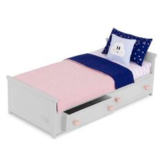 a white bed with pink and blue sheets