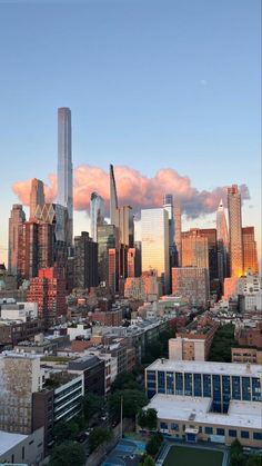 an aerial view of the city skyline at sunset