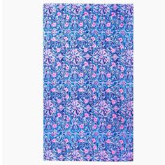 a blue and pink rug with an abstract design