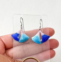 **Please visit my shop for more estate jewelry** Offering is a lovely pair of earrings. They are dangling leaf shape. Front leaves have beautiful pink w/ 2 shades of blue enamel. Back of the leaves stamped 'S925'  to be sterling silver. Fishhooks stamped 925. In good vintage condition w/ light wear on the enamel. Back edge shows wear. Size:  Drop length from hooks approx 1 1/4"  Pls. view these pics as part of the description. All sales are as is & final. Item will be securely packed. Item ship Ground Advantage, expect to take 3-6 business days. To upgrade the service, pls. ask for the quote. Thank you for looking. Blue Hallmarked Earrings, Blue Hallmarked Dangle Jewelry, Blue Leaf-shaped Jewelry Gift, Blue Leaf-shaped Jewelry For Gift, Blue Hallmarked Dangle Earrings, Handmade Blue Leaf-shaped Jewelry, Pink Leaves, Silver Enamel, Leaf Shapes