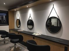 the salon is clean and ready for customers to take their own pictures on it's wall