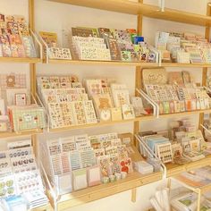 the shelves are filled with many different types of cards and paper goods, all in various shapes and sizes