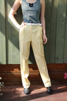 "Vintage Womens Light Yellow High Waist Pants Classic Elegant Trousers With Belted Small Size    Label size: S  Measurements: (lying flat):  Waist: 13\"-  33.5 cm Hips: 16.5\"- 42 cm Width at knee:  9\" - 23 cm Pant leg inseam: 31\" - 79 cm Length:  42\" - 107 cm  Please check measurements to insure a proper fit. Remember to allow yourself some extra room for movement. You can compare these with something from your closet that fits you well.  This pants will come to you freshly laundered and ready to wear. Please convo me if you need additional measurements.  Condition: good Vintage Condition   SHIPPING * I ship worldwide via Priority mail (Latvijas Pasts) from Latvia (EU). * I ship from Europe, so please allow 2 to 4 weeks for the package to arrive if you live overseas. * Europe 5 - 10 bu Classic Full-length Bottoms For Summer, Classic Full-length Summer Bottoms, Summer Workwear Full Length Chinos, Summer Stretch Trousers Work Pants, Classic Full Length Dress Pants For Summer, Fitted High Waist Work Pants For Summer, High Waist Stretch Cotton Dress Pants, Full-length Dress Pants With Belt Loops For Spring, Fitted High-waisted Summer Chinos