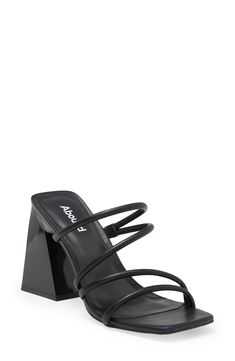 Elevate your wardrobe with this slide sandal featuring a square open toe, tubular straps and angled block heel for effortless style. Synthetic upper and lining/rubber sole Imported Black Open Toe T-strap Sandals With Tang Buckle, Adjustable Black Strappy T-strap Sandals, Adjustable T-strap Black Slingback Sandals, Cheap Black T-strap Sandals With Buckle Closure, Heeled Mule, Black Synthetic T-strap Sandals With Buckle Closure, Adidas Zx, Chunky Platform, Designer Sandals