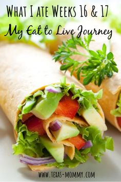 a wrap with lettuce, tomato and avocado on it