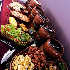 a buffet table filled with lots of different foods