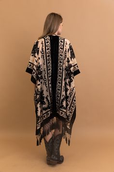 Indulge in elegance with our Velvet Dream Mesh Tapestry Kimono. Crafted from sumptuous velvet and adorned with intricate tapestry motifs, this kimono exudes luxury and style. Perfect for lounging at home or adding a touch of glamour to any outfit. #lovemyleto 50% Viscose 50% Nylon Imported Traditional Kimono With Tassels, Festival Black Shawl Kimono, Elegant Embroidered Kimono For Festival, Black Bohemian Style Festive Kimono, Festive Bohemian Black Kimono, Festive Black Bohemian Kimono, Elegant Festival Kimono, Velvet Tapestry, Tapestry Print