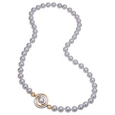 From the Orbit Collection - an 18 inch lustrous Akoya pearl necklace with an asymmetrically placed spiral, surrounded on either side by a 6mm heavy wall gold bead. The necklace is made with 7.5mm - 8mm white, round, lustrous Japanese Akoya pearls hand-tied with silk. This necklace is currently available in 2-tone- 14ky gold and argentium silver with a strong magnetic clasp. If you would like the spiral positioned differently, it can be re-tied and positioned to your liking. As it is positioned n Dangly Necklace, Star Clusters, Necklaces Beaded, Akoya Pearl Necklace, Teardrop Diamond, Pearl Strands Necklace, Tiny Diamond, Argentium Silver, Modern Necklaces