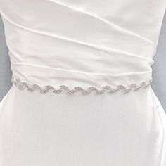 Bridal Leaf Belt, Bridal Belt Leaf, Leaf Bridal Belt, Wedding Leaf Sash, Belts for Wedding Dress Enhance your wedding gown with the delicate radiance of our Bridal Leaf Belt. Experience the subtle beauty of this slender accessory. Sparkle and glow on your special day. 💖 Details - Embellishment measures 17.75 inches long and .75 inches wide - Measures 98.5 inches long - Handmade with sparkling rhinestones 💖 Packaging Each accessory is delicately packaged in our exclusive soft and luxe velvet bag, ensuring its pristine condition until your special day. 💖 Shipping This item is currently in stock, and will be shipped within 2 business days from NY 💖 Returns & Exchanges At bridal accessories shop, we understand that planning your dream wedding can be a whirlwind, and your desire to look lik White Wedding Dress With Sashes, Silver Fitted Bridal Accessories, Silver Bridesmaid Sashes Bridal Accessories, Silver Fitted Bridal Belt, Fitted Silver Bridal Belt For Bride, Fitted Silver Bridal Belt For Bridesmaid, Silver Fitted Bridal Belt For Bridesmaid, Fitted Bridal Sashes For Bride, White Fitted Bride Sash