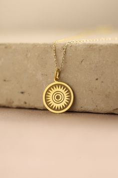 Gold Sun Pendant - Sun Gold Necklace ● Material of pendant: Solid Gold 14k ( REAL GOLD ) ● Metal Stamp: 14k ( REAL GOLD ) ● The pendant is available in 5 sizes: - 12,7 mm / 0.5 inches (Diameter) - 14,0 mm / 0,55 inches ( Diameter ) In the photos - 15,3 mm / 0.6 inches ( Diameter ) - 16,5 mm / 0,65 inches ( Diameter ) - 19,1 mm / 0,75 inches ( Diameter ) ( In the photos the size is 14mm / 0.55 inches Diameter ) ( Jump Ring inner diameter: 4 mm ) ● Material of chain: Solid gold 14k ( REAL GOLD ) I Spiritual 14k Gold-filled Yellow Gold Charm Necklace, Spiritual 14k Gold Filled Yellow Gold Charm Necklaces, Handmade Yellow Gold Charm Necklace With Round Pendant, Handmade Yellow Gold Round Pendant Charm Necklace, Spiritual Yellow Gold Necklace As Gift For Her, 14k Gold Filled Spiritual Necklaces, 14k Gold Engraved Amulet Charm Necklace, Handmade 14k Yellow Gold Charm Necklace, Spiritual Yellow Gold Charm Necklace For Her