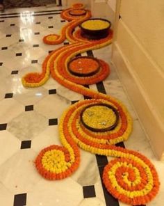 a long line of flower decorations on the floor