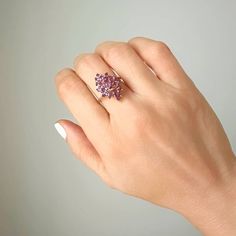 This vintage piece features a beautiful Marquise shaped Amethyst cluster set in 14K Yellow Gold. The Amethyst stones make up approximately 1 carat total weight and the ring weighs 4 grams. An eye-catching and timeless addition to any jewelry collection. Size 7 sizing available with fee contact us to have it added to the price before checkout.Thank you for visiting our shop!Visit our website DmKJewelry.comAlso Follow us on Instagram https://www.instagram.com/dmkjewelryny/ 14k Gold Birthstone Cluster Ring, Amethyst Cluster Gemstone Jewelry, 14k Gold Cluster Ring With Birthstone, Yellow Gold Birthstone Cluster Ring, Pink Cluster Ring With Gemstone, Pink Cluster Gemstone Ring, Elegant Purple Multi-stone Cluster Ring, Cluster Ring With Prong Setting As Gift, Purple Cluster Ring With Accent Stones