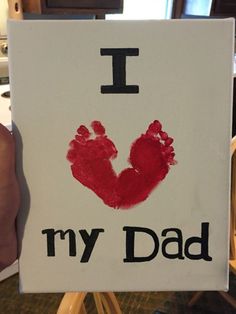 a handprint that says i love my dad on the side of a white sign