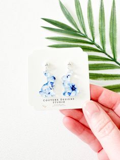 These little Blue and White Floral Easter Bunny Earrings are just so pretty and such a fun way to celebrate Easter.  They are are made using a blue and white floral french toile inspired acrylic little Easter Bunnies. The total length of these earrings measure approximately 1.25 inches tall and .75 inches wide. These earrings are set using your choice of Stainless Steel Silver or Gold Ball Posts OR lead free and nickel free ear wires (suitable for even sensitive ears) in a Gold or Silver finish. Elegant Blue Resin Earrings, Easter Bunny Earrings, Clear Packaging, Easter Earrings, French Toile, Bunny Earrings, Earring Card, Easter Bunnies, Blue And White Floral