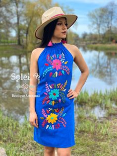 This Beautiful Halter Dress is the perfect Party dress. Its cute design and bold colors is the perfect combination, it also has elastic on the back for a tighter fit. The large florals are all hand embroidered which means the embroidered details vary On each dress, making them one of a kind. Purchase the earrings modeled here: https://www.etsy.com/es/listing/789091492/aretes-artesanales-pintado-a-mano-aretes?ref=listings_manager_grid Multicolor Sleeveless Embroidered Dress For Beach, Blue Floral Embroidered Mini Dress For Vacation, Blue Floral Embroidery Mini Dress For Vacation, Blue Embroidered Mini Dress For Party, Fitted Multicolor Embroidered Dress For Vacation, Multicolor Embroidered Mini Length Dress, Multicolor Mini Dress With Floral Embroidery For Summer, Multicolor Floral Embroidery Mini Dress For Summer, Multicolor Summer Dress With Floral Embroidery