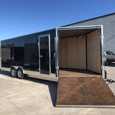 an enclosed trailer parked in a parking lot