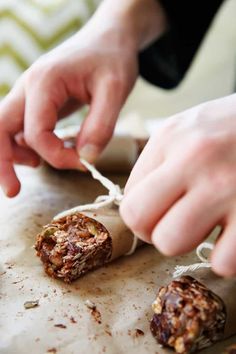 a person is peeling something off of a piece of food