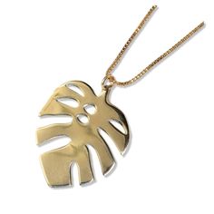 Flora Monstera Drop Pendant Necklace Brass Gold Metal Necklace For Beach, Gold Metal Necklaces For Beach, Trendy Gold Leaf Jewelry, Trendy Gold Jewelry For Vacation, Chic Gold Jewelry For Vacation, Gold Leaf-shaped Nature-inspired Necklace, Gold Nature-inspired Metal Necklace, Gold Necklace With Adjustable Chain For Vacation, Trendy Metal Necklaces For The Beach