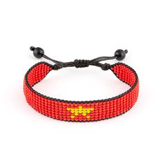 This adjustable handmade bracelet celebrates Vietnam heritage. Crafted from colorful beads in the iconic pattern of the Vietnam flag, this bracelet makes a bold yet understated style statement. An adjustable cord allows it to fit wrists of different sizes so it can be shared or worn year-round. Lightweight and versatile, it pairs well with casual or dressy outfits for a pop of color. Wear it to show your Vietnamese pride or as a conversation starter to share your cultural background. The intricate beading is done by hand, so each piece has its own unique texture and charm.    Exported By ExportYourStore :) Adjustable Letter Beads Friendship Bracelets For Festival, Adjustable Friendship Bracelets With Letter Beads For Festival, Symbolic Multicolor Beaded Bracelets As Gift, Adjustable Letter Beads Bracelets For Festivals, Adjustable Letter Beads Bracelet For Festival, Adjustable Beaded Bracelets With Letter Beads For Festival, Symbolic Hand-strung Adjustable Beaded Bracelets, Adjustable Red Friendship Bracelets With Colorful Beads, Red Beaded Bracelets With Adjustable Length