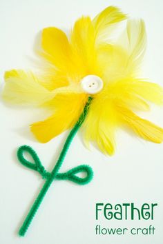 a yellow flower with green stems and a white button