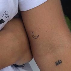 two people with matching tattoos on their arms