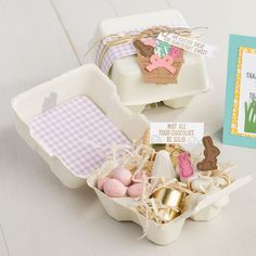 an egg carton filled with lots of different types of candies and chocolates