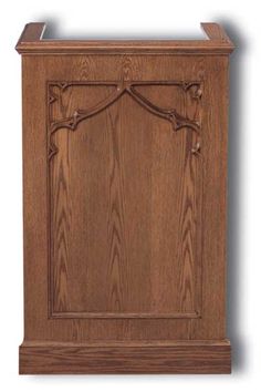 a wooden cabinet with an ornate design on the front and side panel, made out of wood