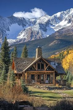 a log cabin with mountains in the background