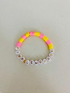 If you like summertime🏖️here's a pink lemonade bracelet Fun Beaded Stretch Bracelet For Summer, Spring Beach Bracelets With Letter Beads, Yellow Beaded Bracelet For Vacation, Casual Letter Beads Friendship Bracelets For Spring, Casual Beaded Bracelets For Spring Vacation, Pink Summer Jewelry For Gifts, Summer Pink Beaded Friendship Bracelets, Playful Summer Friendship Bracelets With Letter Beads, Summer Beaded Pink Friendship Bracelets