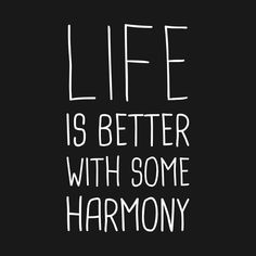 the words life is better with some harmony written in white ink on a black background