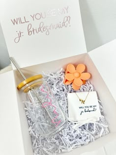 an open box with some items in it and a note on the inside that says will you be my bridesmaid?