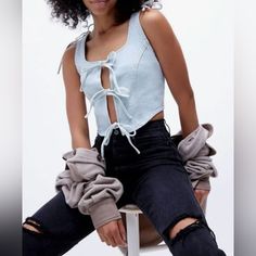 Nwt Urban Outfitters Milk It Romance Blue Stonewash Denim Corset Top Size Us 6 Relaxed And Laid Down Pit To Pit (Back) 18in. Introducing A Stunning Blue Stonewash Denim Corset By Urban Outfitters. This Crop Top Is Perfect For Any Occasion, Be It A Travel Adventure, Party Or Casual Day Out. Made From 100% Cotton, This Top Features A Square Neckline With Wide Straps For Comfort. The Corset Is Adorned With Tie Front, Bow, And Lace-Up Accents, Giving It A Designer Look. It's A Brand New Top With Tag Cream Bodysuit, Urban Outfitters Tank Top, Adventure Party, Milk It, Denim Corset Top, Boho Crop Tops, Denim Corset, White Shirts Women, Tunic Tank Tops