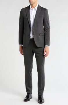 Clean lines and simple details yield a refined appearance in this elegant suit that's tailored in a slim fit. Jacket has front button closure; notched lapels; four-button cuffs; front flap pockets; chest welt pocket Lined 70% nylon, 24% polyester, 4% spandex, 2% other fibers
 Dry clean Imported Business Casual Pantsuit With Pressed Crease, Timeless Suits In Suiting Fabric For Office, Timeless Office Wear Suits In Suiting Fabric, Sleek Notch Lapel Suit For Office, Sleek Notch Lapel Suits For Office Wear, Slim Fit Tuxedo Style Blazer For Office, Slim Fit Tuxedo Blazer For Office, Sleek Office Wear Suits With Pressed Crease, Sleek Tailored Suit For Workwear