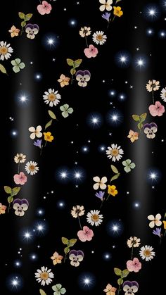 a black background with flowers and stars on it