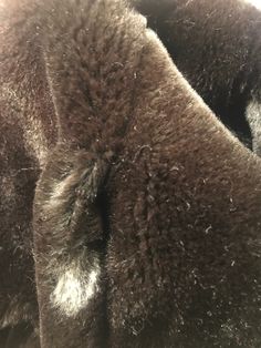 "Beautiful vintage faux fur coat is brown w/shawl collar, buttons up in front w/navy blue buttons, hidden leather detail inside, fully lined, pockets on sides. ( jeans not included) Good vintage condition. Minimal signs of wear. There is a hole on seam ( just in faux fur doesn't go through lining) about 1\" above both pockets ... seems intentional but not sure the purpose? ( see last photo for details) No brand, size or material label 'Clean by fur coat method' label inside Fits women's size: Sm Brown Winter Fur Coat With Button Closure, Brown Fur Coat With Button Closure For Fall, Brown Fur Coat With Buttons For Fall, Classic Brown Outerwear With Faux Fur Lining, Classic Mink Outerwear With Faux Fur Lining, Brown Winter Fur Coat For Formal Occasions, Brown Fur Coat For Formal Winter Occasions, Classic Brown Fur Coat With Faux Fur Trim, Classic Brown Long Fur Coat