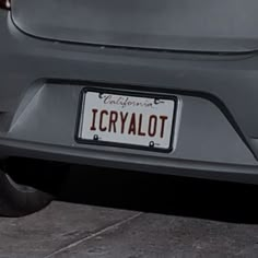 the license plate on the back of a car reads icrysalot and is red