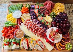 a platter filled with lots of different types of food