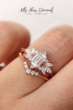 a woman's hand with a diamond ring on it