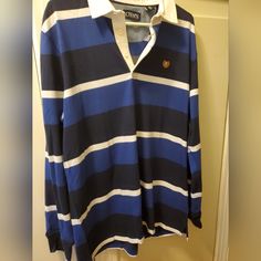 This Chaps By Ralph Lauren Men's Pullover Sweater Jersey Is Perfect For Any Occasion, Whether You're Traveling, Going To Work, Or Just Hanging Out Casually. The Navy Blue And Dark Blue Striped Pattern Gives It A Classic Look, While The Collared Neckline Adds A Touch Of Sophistication. Made From 100% Cotton Knit Fabric, It's Comfortable And Easy To Wear, And The Long Sleeves Make It Perfect For Colder Seasons Like Fall, Winter, And Spring. Navy Long Sleeve Polo Sweater, Blue Collared Cotton Sweater, Navy Casual Long Sleeve Polo Sweater, Navy Long Sleeve Casual Polo Sweater, Casual Blue Polo Sweater, Mens Pullover Sweater, Men's Chaps, Men's Pullover, Athleisure Casual